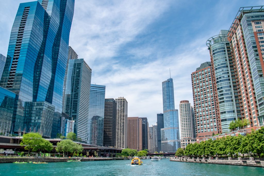 Boats on Chicago River Going Towards Skyline on Summer Day Chicago Business Address